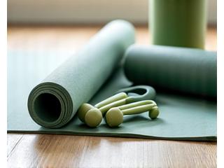 Yoga mat, resistance bands, and light dumbbells ready for home workout